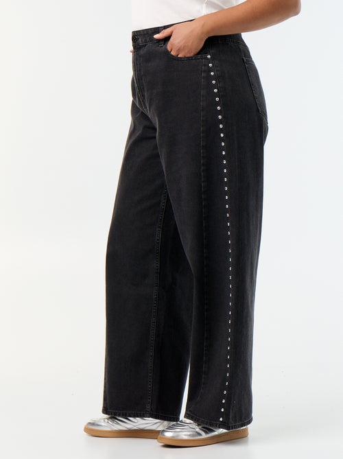 Jeans wide leg con tagli fantasia e borchie - Kiabi Jeans wide leg con tagli fantasia e borchie - Kiabi