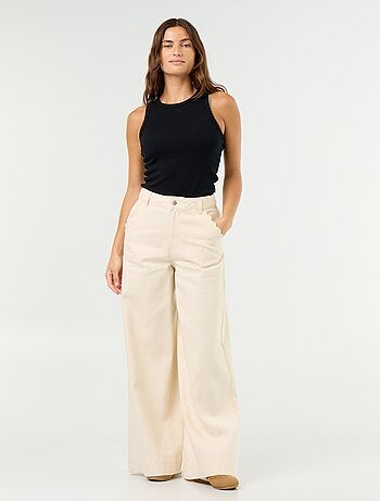 Jeans wide leg con tasche intagliate