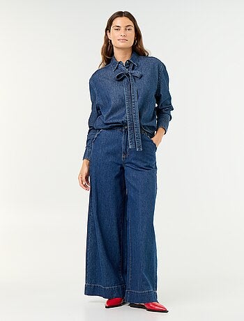 Jeans wide leg con tasche intagliate