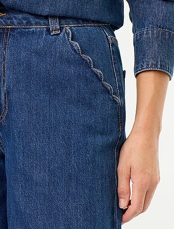 Jeans wide leg con tasche intagliate