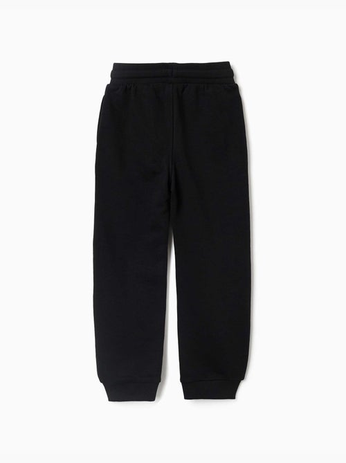 Joggers in pile con stampa che si illumina al buio - Kiabi Joggers in pile con stampa che si illumina al buio - Kiabi