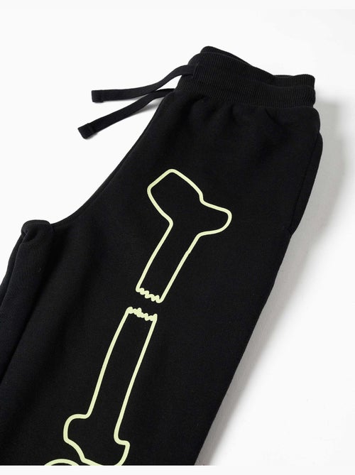 Joggers in pile con stampa che si illumina al buio - Kiabi Joggers in pile con stampa che si illumina al buio - Kiabi