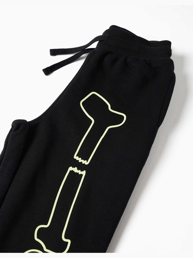 Joggers in pile con stampa che si illumina al buio Nero Nero - Kiabi