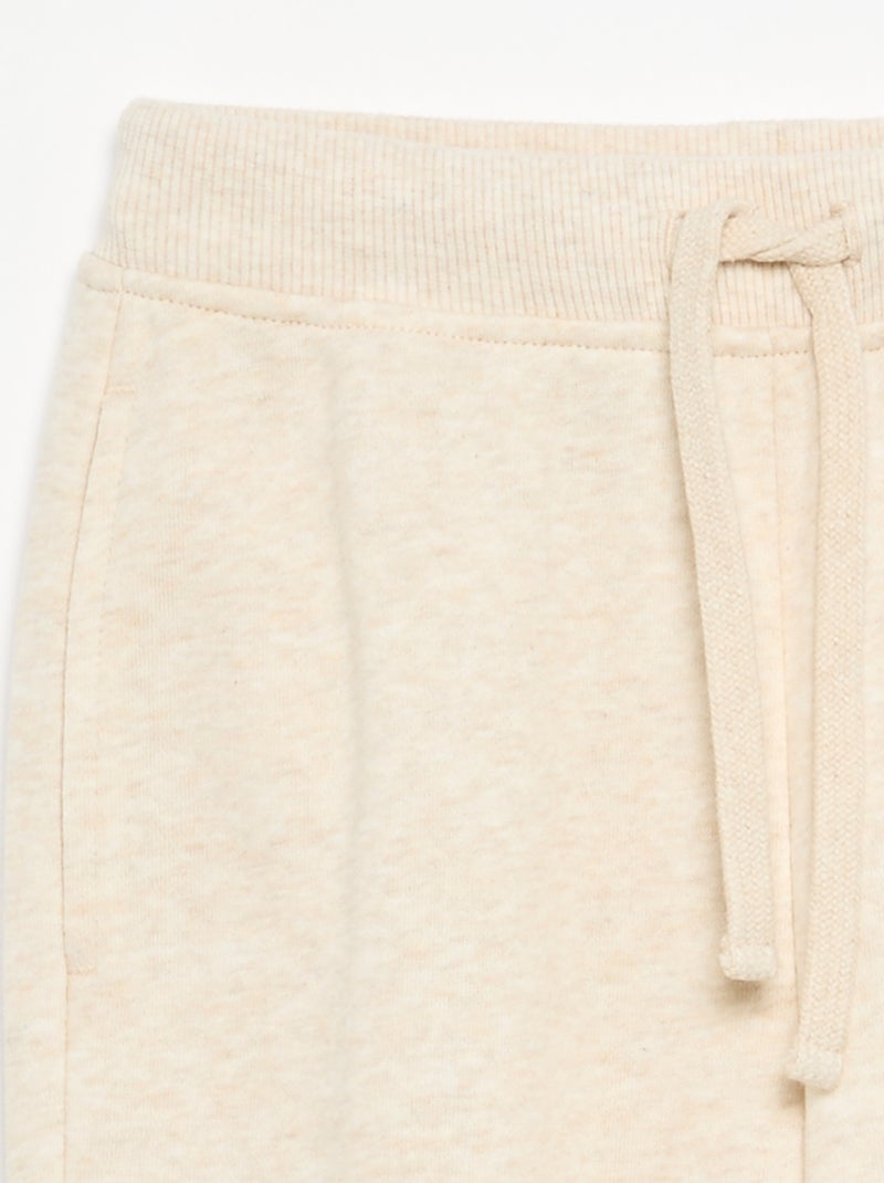 Jogging a tinta unita con vita elasticizzata Beige - Kiabi