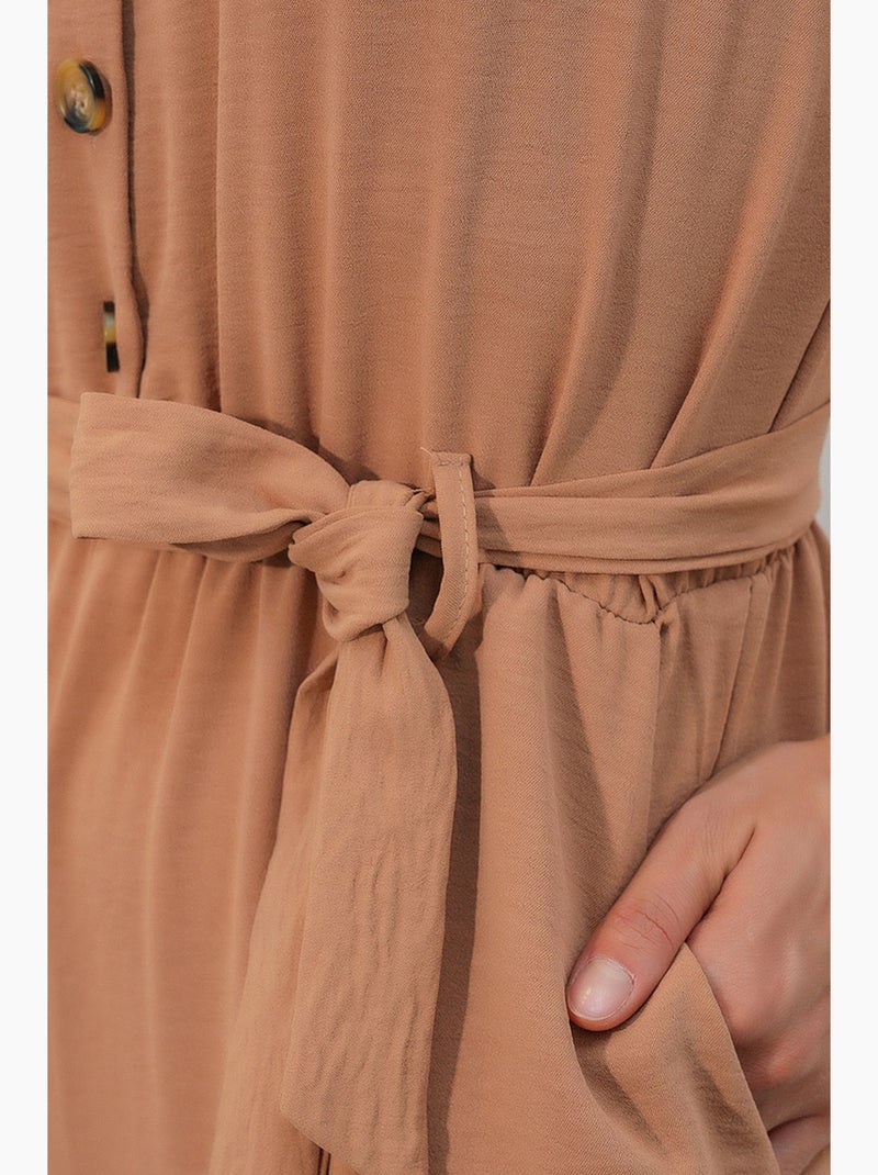 Jumpsuit tinta unita in tessuto con colletto a camicia e dettaglio fiocco bdart Grège - Kiabi