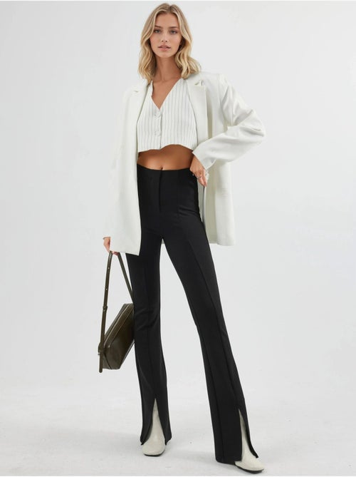 Leggings a zampa a vita alta con dettagli a spacco busem - Kiabi Leggings a zampa a vita alta con dettagli a spacco busem - Kiabi