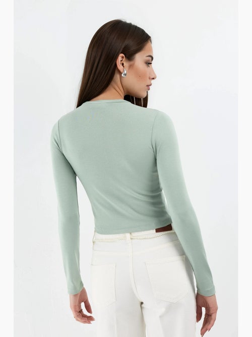 Maglia aderente corta scollo tondo maniche lunghe busem - Kiabi Maglia aderente corta scollo tondo maniche lunghe busem - Kiabi