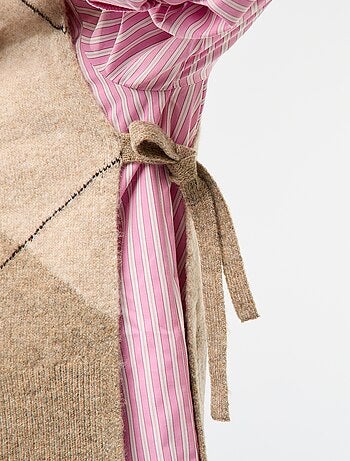 Maglione smanicato con lacci da annodare sui lati