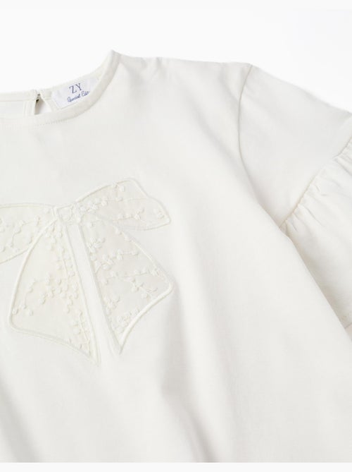 Maglietta con volant e fiocco ricamato - Kiabi