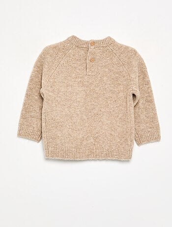 Maglione caldo a trecce
