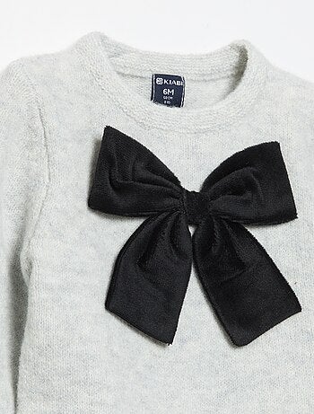 Maglione con grande fiocco fantasia