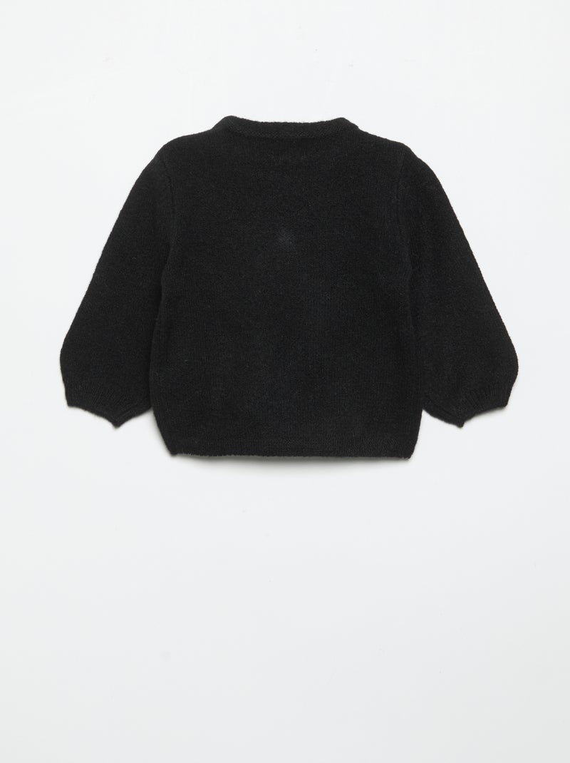 Maglione con grande fiocco fantasia Nero - Kiabi
