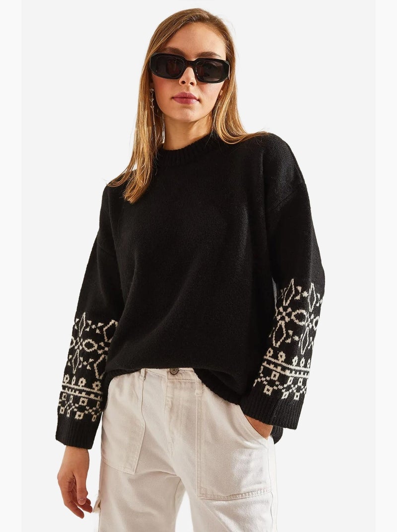 Maglione con maniche a fantasia lucci Nero Bianco - Kiabi