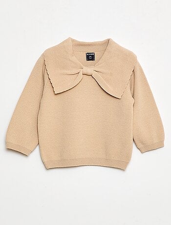 Maglione in maglia con un ampio fiocco decorativo sul davanti