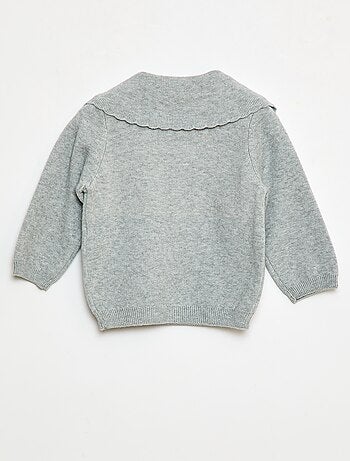 Maglione in maglia con un ampio fiocco decorativo sul davanti