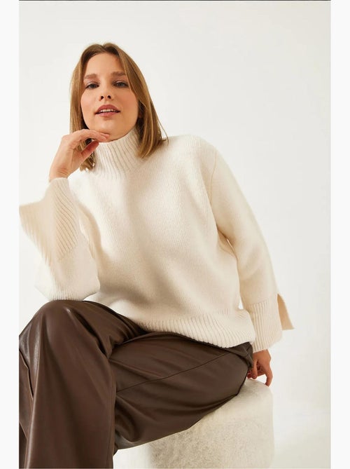 Maglione lavorato a maglia con maniche a spacco lucci - Kiabi Maglione lavorato a maglia con maniche a spacco lucci - Kiabi