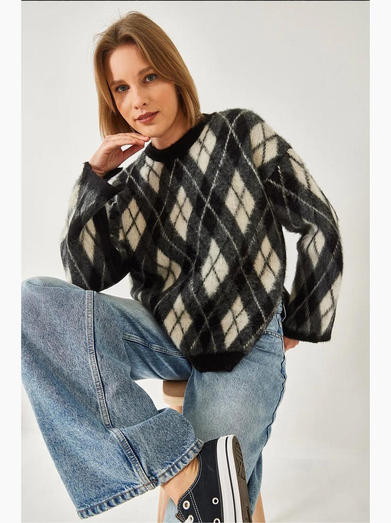Maglione lavorato a maglia con spacchi e motivo a rombi in pile lucci Nero - Kiabi