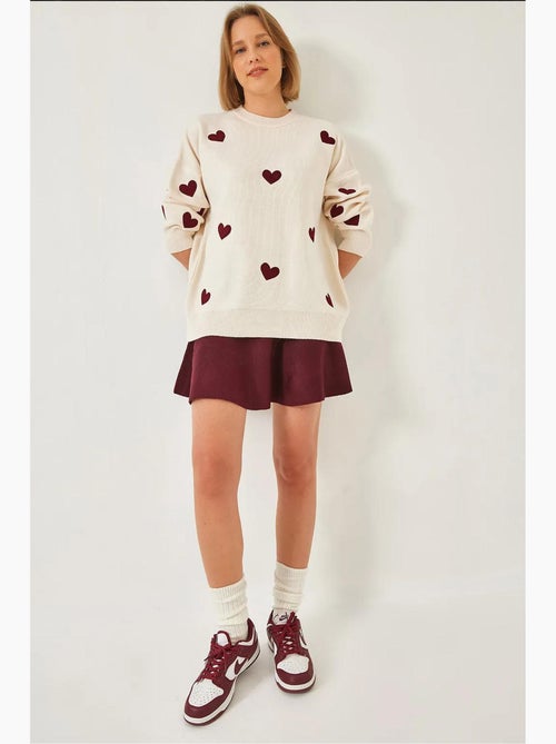 Maglione lungo in maglia con ricamo a cuore lucci - Kiabi Maglione lungo in maglia con ricamo a cuore lucci - Kiabi