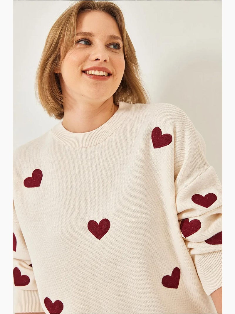 Maglione lungo in maglia con ricamo a cuore lucci Crema - Kiabi