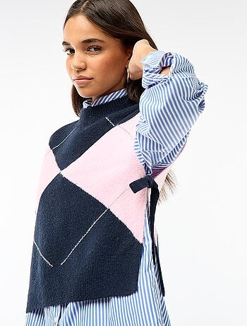 Maglione smanicato con lacci da annodare sui lati