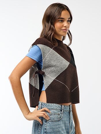 Maglione smanicato con lacci da annodare sui lati