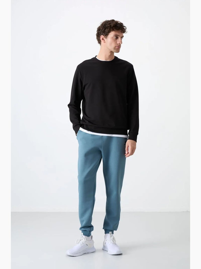 Men's felpa tinta unita con girocollo tommy Nero - Kiabi