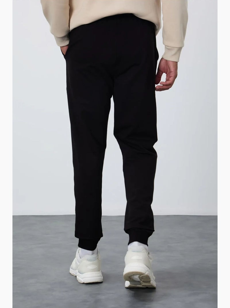 Men's pantaloni della tuta in pile tinta unita tommy Nero - Kiabi