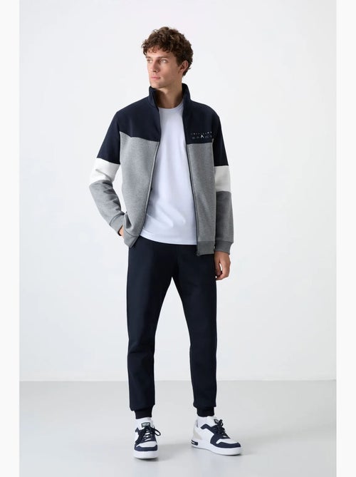 Men's set di felpa con zip e pantaloni color block tommy - Kiabi Men's set di felpa con zip e pantaloni color block tommy - Kiabi