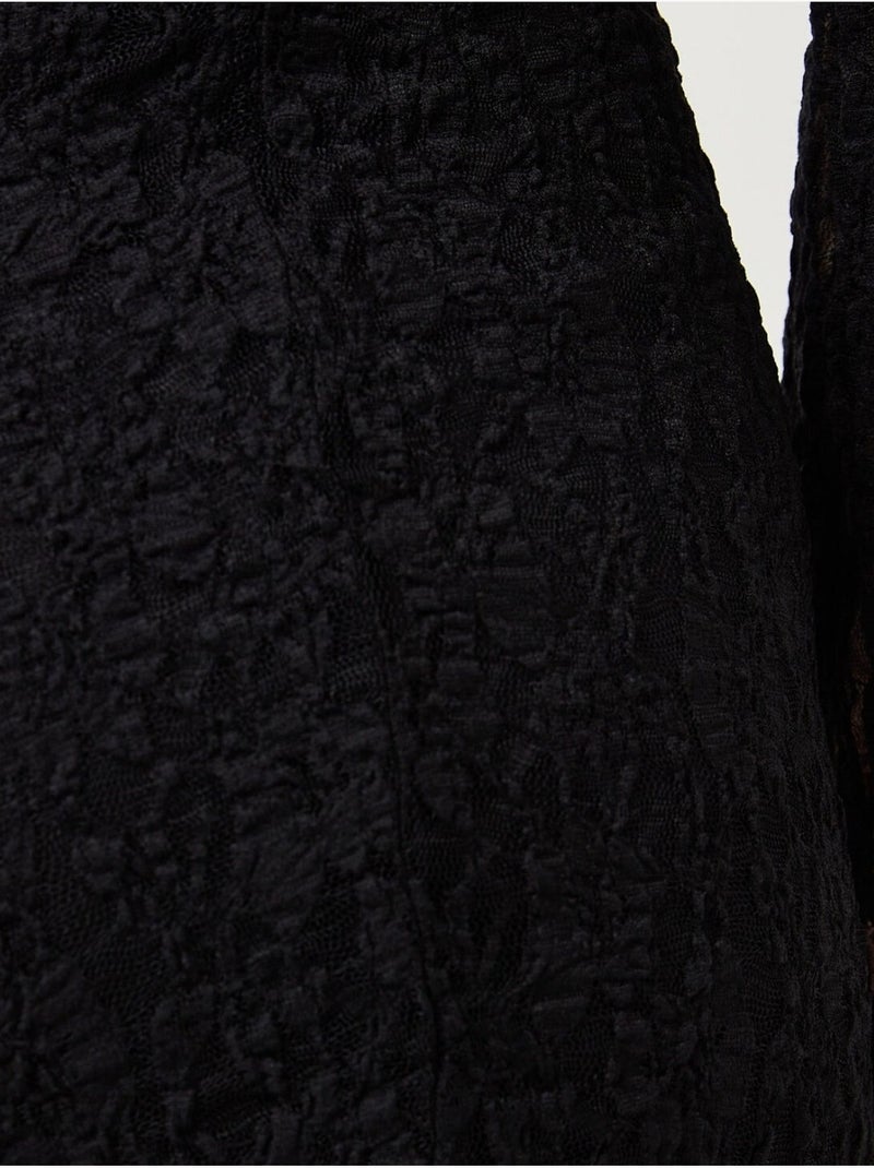 Mini abito aderente in pizzo con fodera Nero - Kiabi