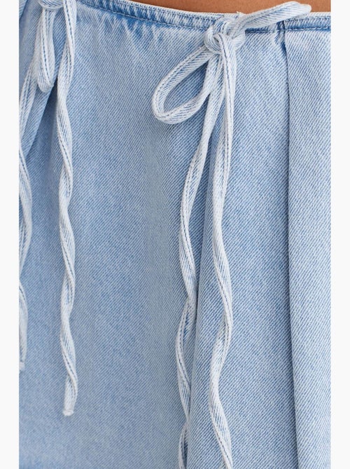 Minigonna a trapezio in denim di cotone con dettaglio fiocco dilvin - Kiabi Minigonna a trapezio in denim di cotone con dettaglio fiocco dilvin - Kiabi