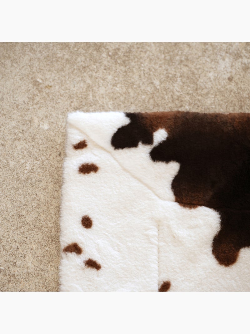 Morbido plaid con motivo a pelle di mucca e retro in velluto Marrone scuro - Kiabi