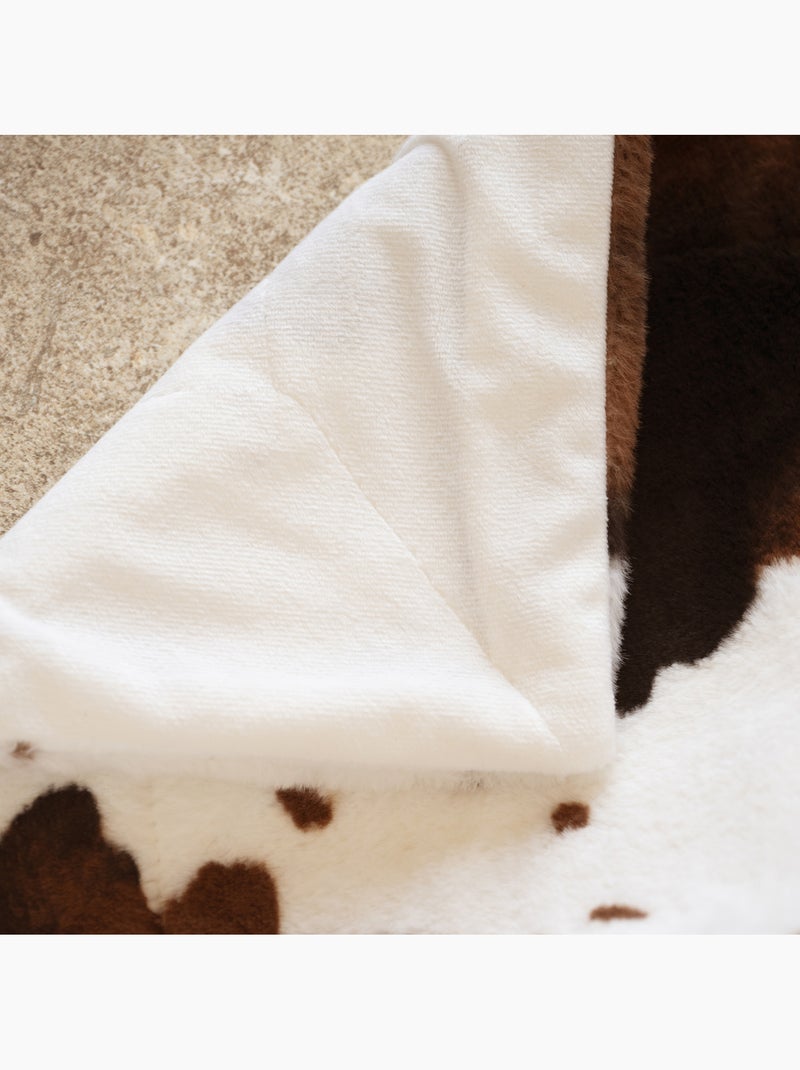 Morbido plaid con motivo a pelle di mucca e retro in velluto Marrone scuro - Kiabi