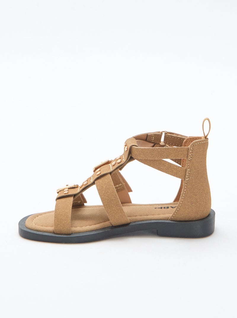 Paio di sandali bassi con listini borchiati Beige - Kiabi