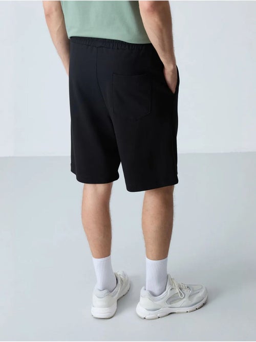 Pantaloncini felpati da uomo in misto cotone tommy - Kiabi Pantaloncini felpati da uomo in misto cotone tommy - Kiabi