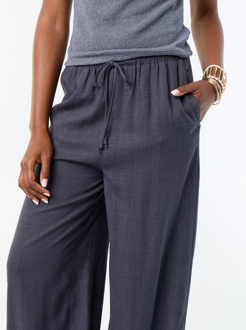 Pantalone a palloncino tinta unita con 2 tasche - Kiabi Pantalone a palloncino tinta unita con 2 tasche - Kiabi