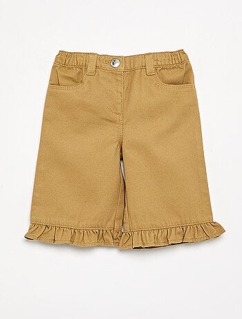 Pantalone a tinta unita con fondo a balze