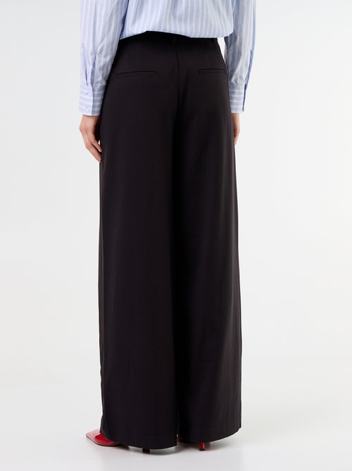 Pantalone ampio a vita alta con pinces - Kiabi Pantalone ampio a vita alta con pinces - Kiabi