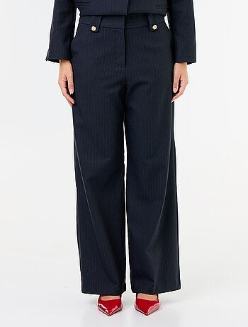 Pantaloni ampi con bottoni dorati