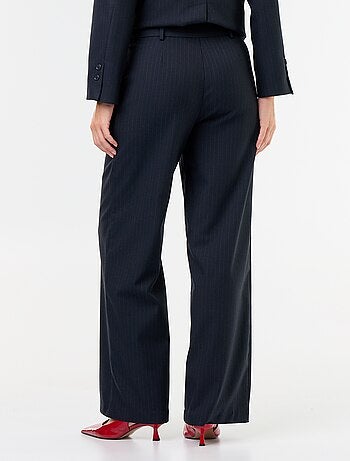 Pantaloni ampi con bottoni dorati