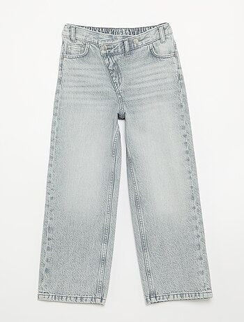 Pantalone in denim con abbottonatura asimmetrica