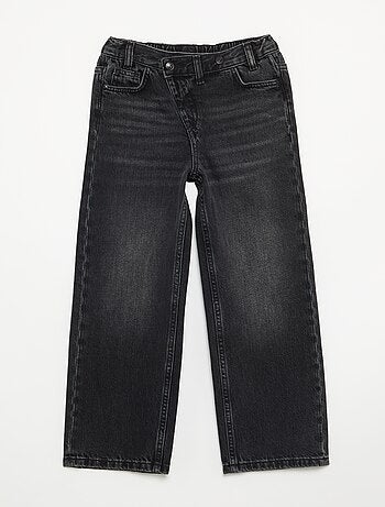 Pantalone in denim con abbottonatura asimmetrica