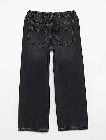 Pantalone in denim con abbottonatura asimmetrica