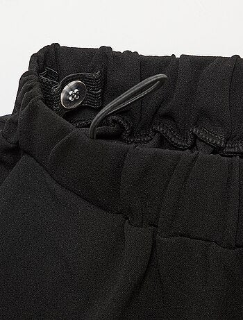 Pantalone largo da donna a vita alta in maglia leggera