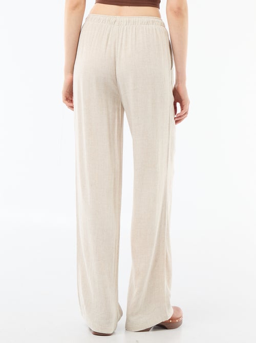 Pantalone largo da donna in lino con vita elasticizzata - Kiabi Pantalone largo da donna in lino con vita elasticizzata - Kiabi