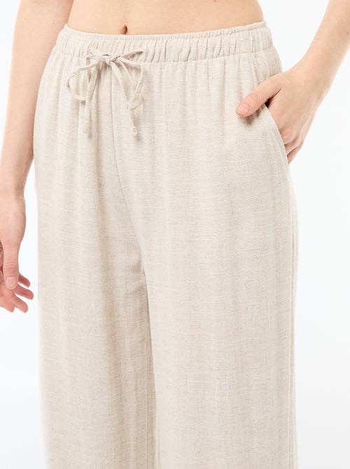 Pantalone largo da donna in lino con vita elasticizzata - Kiabi Pantalone largo da donna in lino con vita elasticizzata - Kiabi