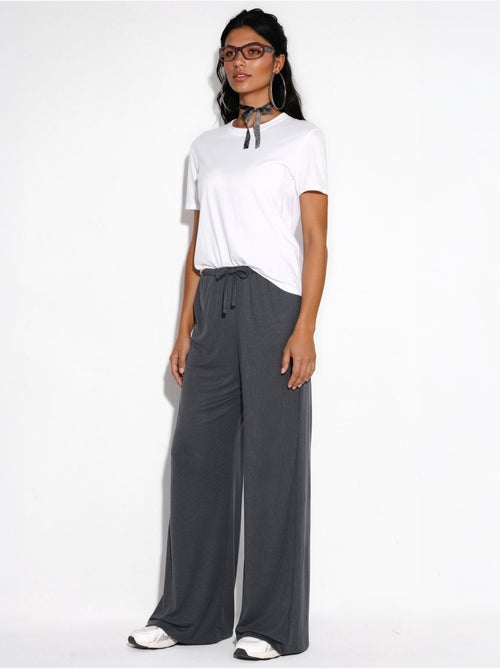 Pantaloni a gamba ampia con coulisse busem - Kiabi Pantaloni a gamba ampia con coulisse busem - Kiabi