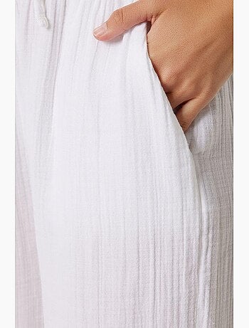 Pantaloni a gamba ampia con coulisse in vita e dettaglio con bordino istanbul