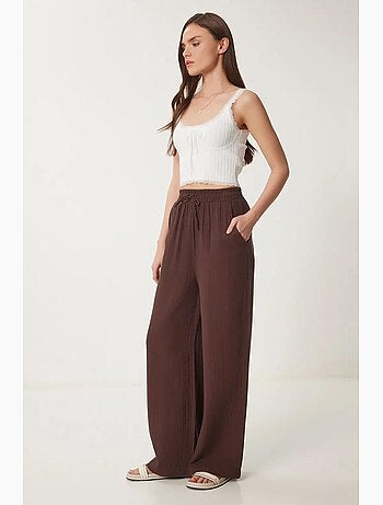 Pantaloni a gamba ampia con coulisse in vita e dettaglio con bordino istanbul