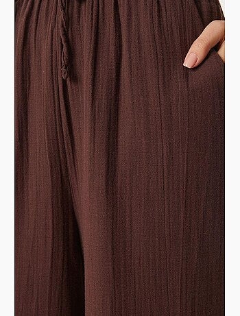 Pantaloni a gamba ampia con coulisse in vita e dettaglio con bordino istanbul