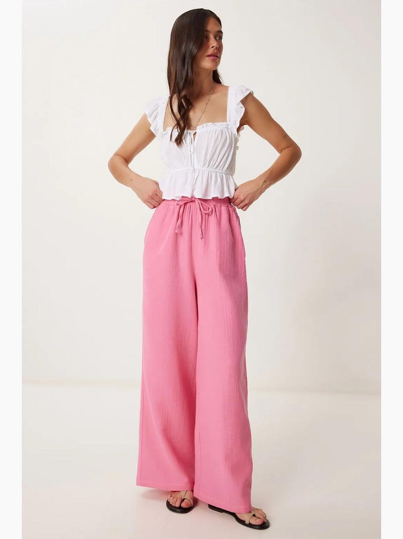 Pantaloni a gamba ampia con coulisse in vita e dettaglio con bordino istanbul Rosa fluo/Solinotes - Kiabi